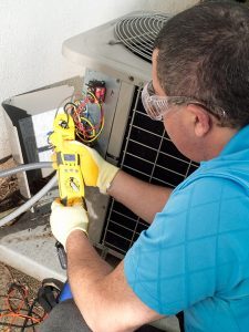 hvac-technician-repairing-air-conditioning-unit